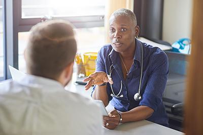GP in clinic