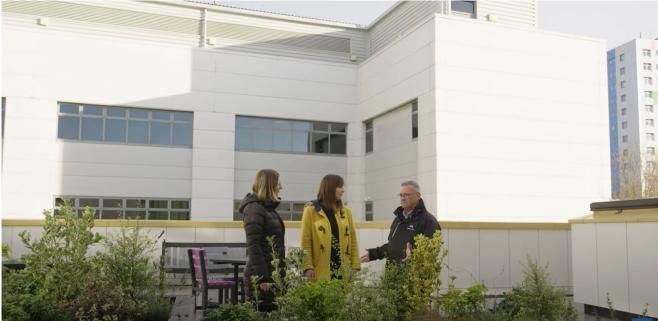 Photo of people outside hospital building