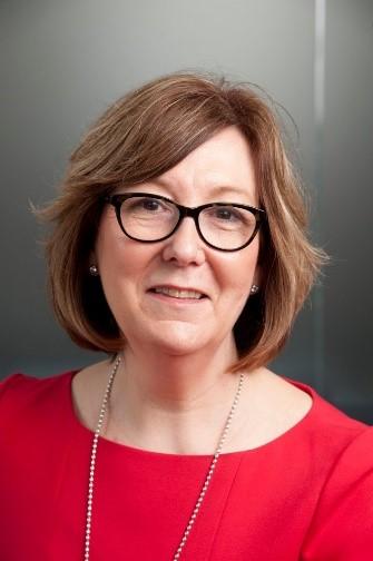 Portrait photo of Liz Fenton looking straight ahead and smiling