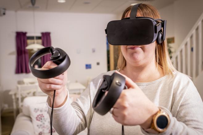 Woman study at home using VR headset