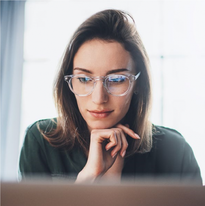 An image of a person looking at a computer