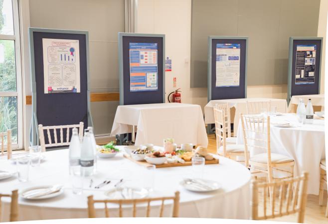 Posters on display stands at the event